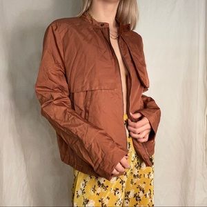 Burnt orange wind breaker
